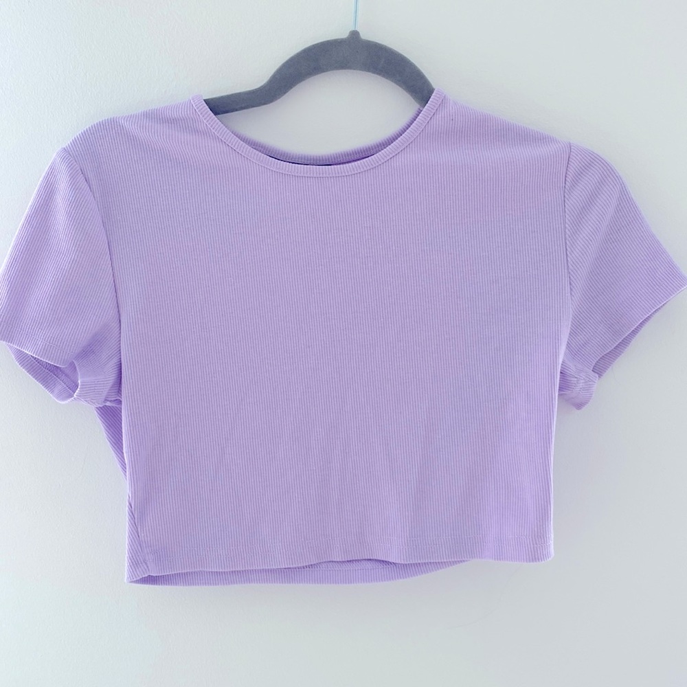 Light purple cropped shirt.